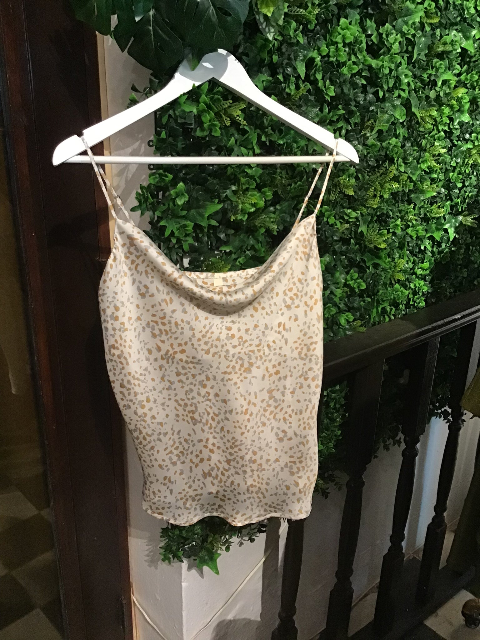 Cream colored spaghetti strap silk camisole spotted with gold and silver