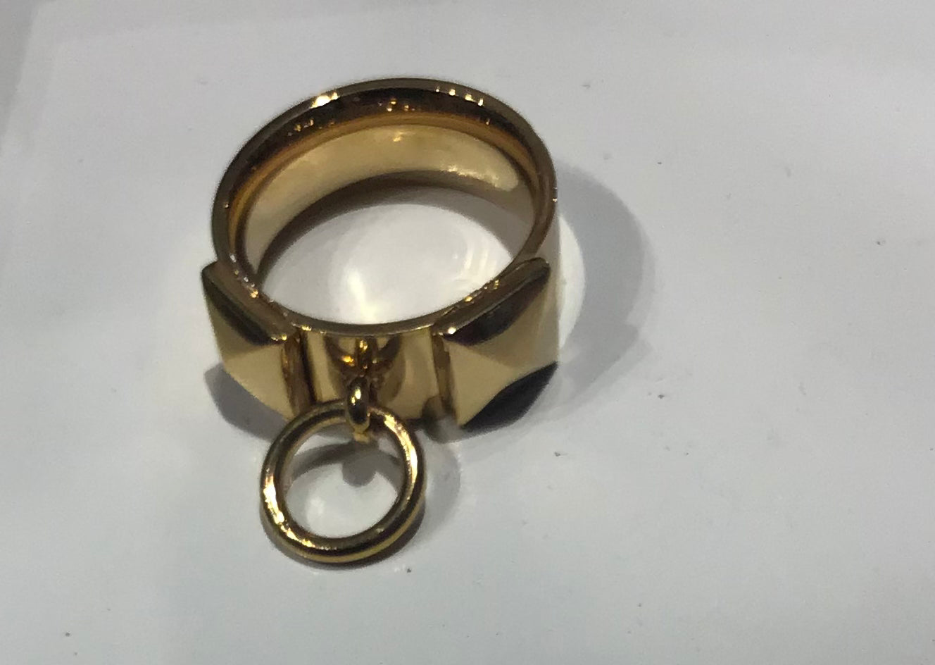 Ring with two studs and added small ring detail